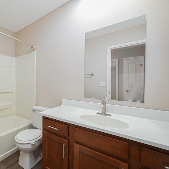 a bathroom with a sink toilet and bath tub