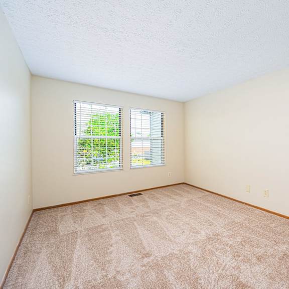a room with carpet and a window