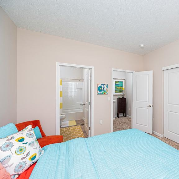 a bedroom with a bed and a closet