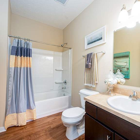 a bathroom with a sink toilet and a shower