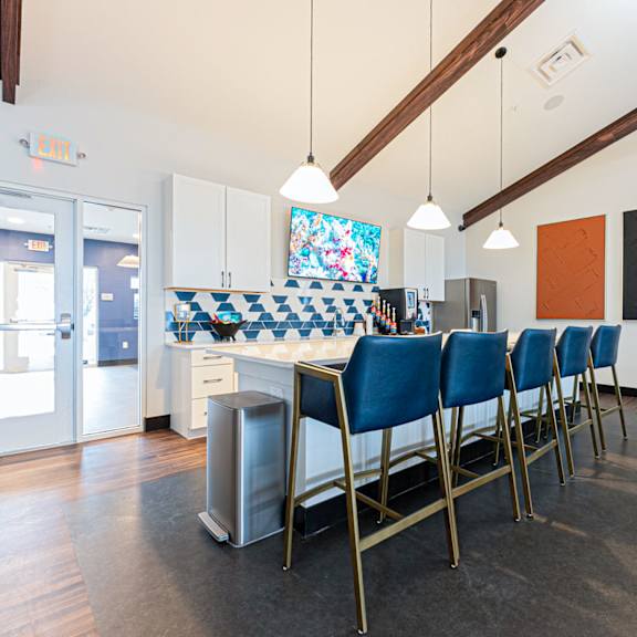 a kitchen with a table and chairs.