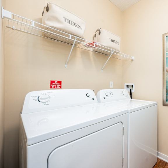 a washer and dryer in the laundry room of a rental home