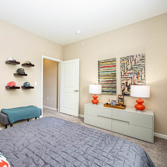 a bedroom with a bed and a closet