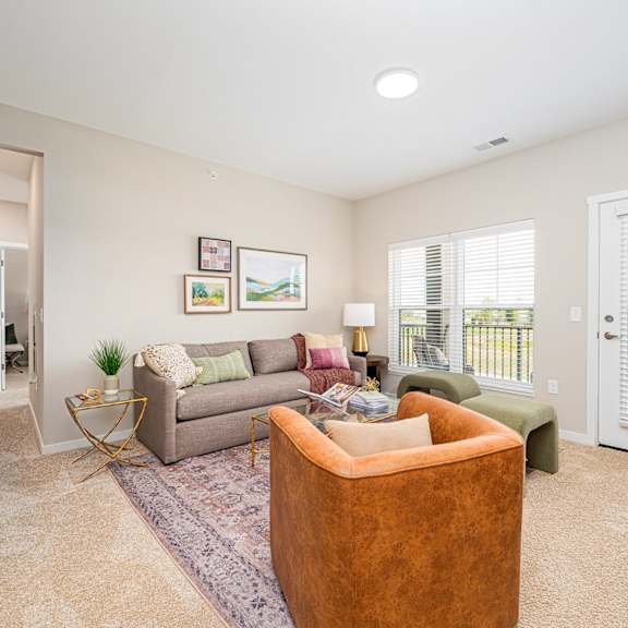 a living room with a couch and a chair