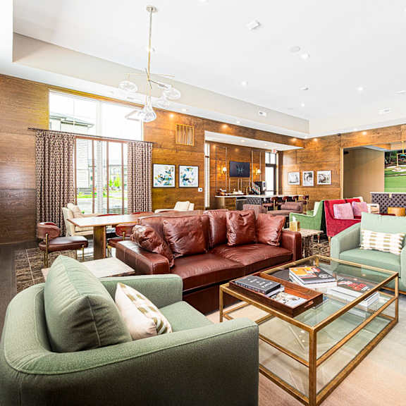 a living room with couches and chairs and a table