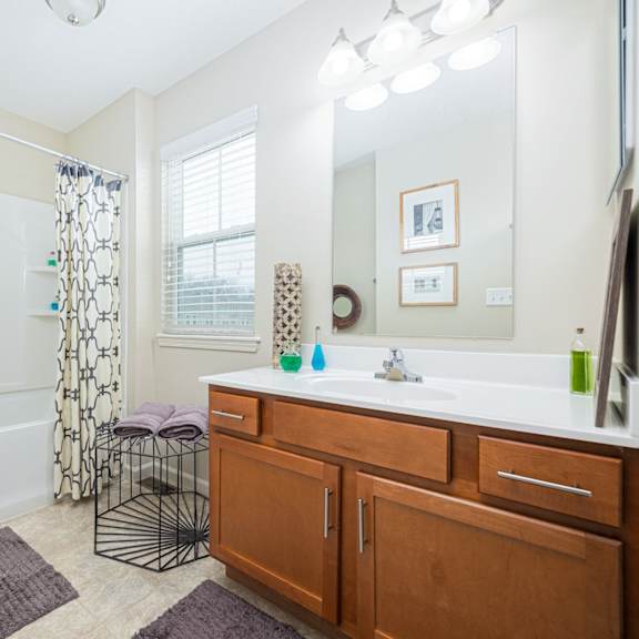 a bathroom with a white toilet, a white sink, and a white bathtub.
