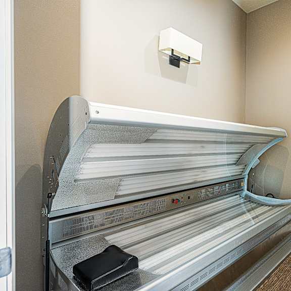 a room with a bed and a closet with papers on it