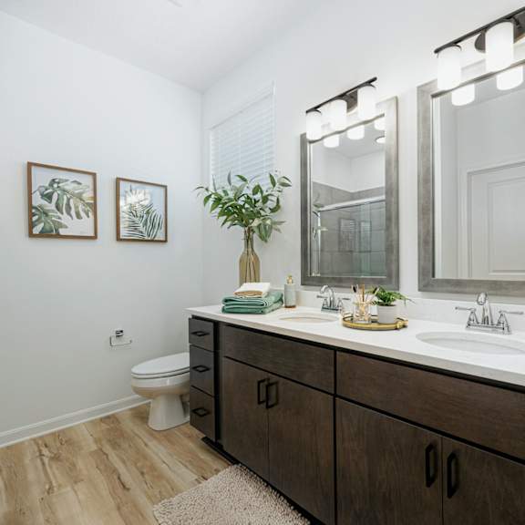 a bathroom with a large mirror and a sink
