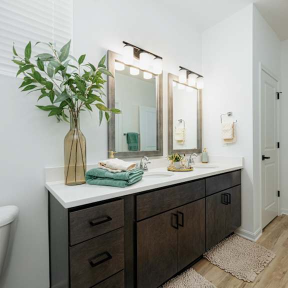 a bathroom with a sink and a toilet and a mirror