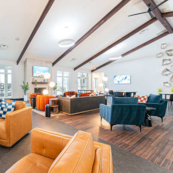 a large room with a pool table and a television.