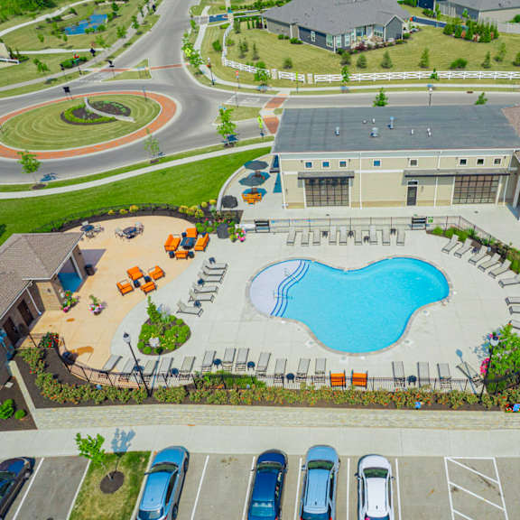 an aerial view of a large swimming pool in a parking lot