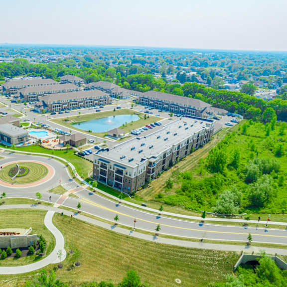 an aerial view of a city with roads and buildings