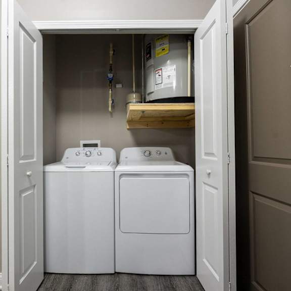 a laundry room with two washes and a dryer in it