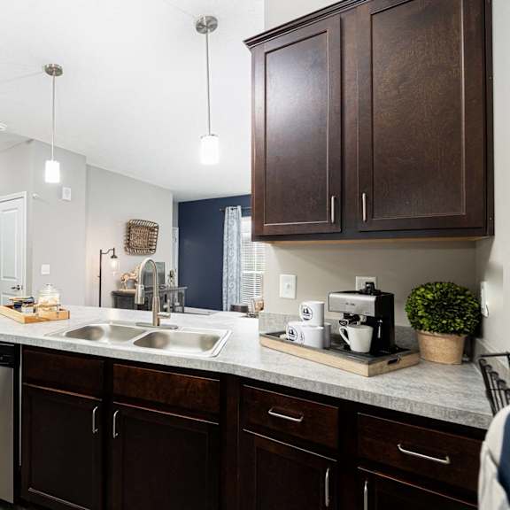 spacious kitchen with stainless steel appliances at the district flats apartments in lenexa