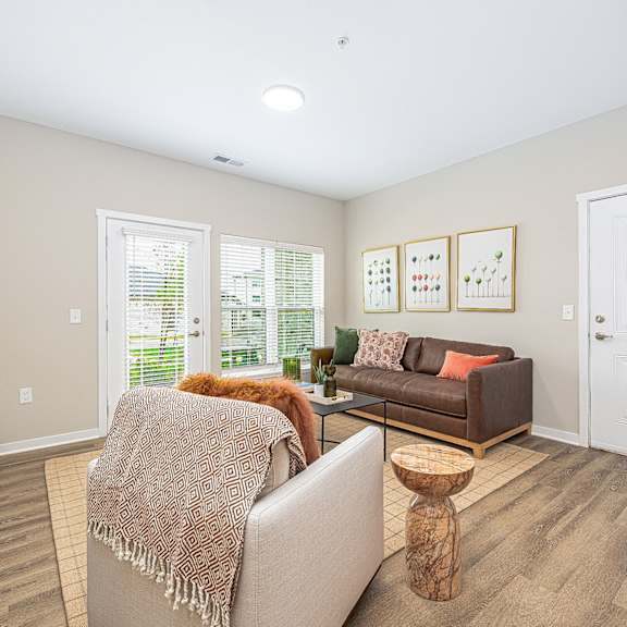 a living room with two couches and a table