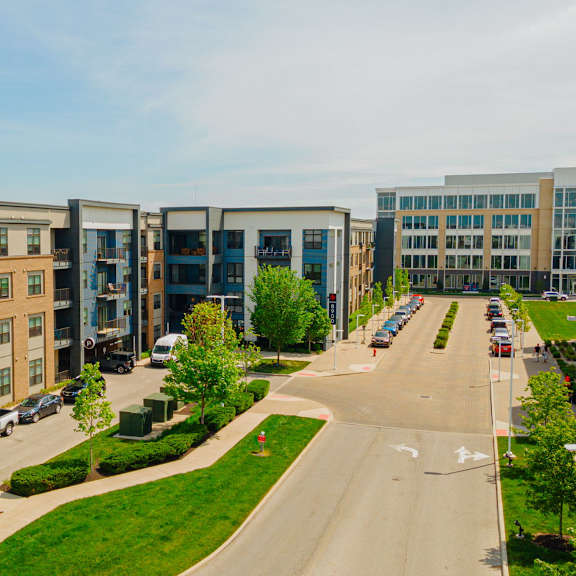 a row of apartment buildings on a city street