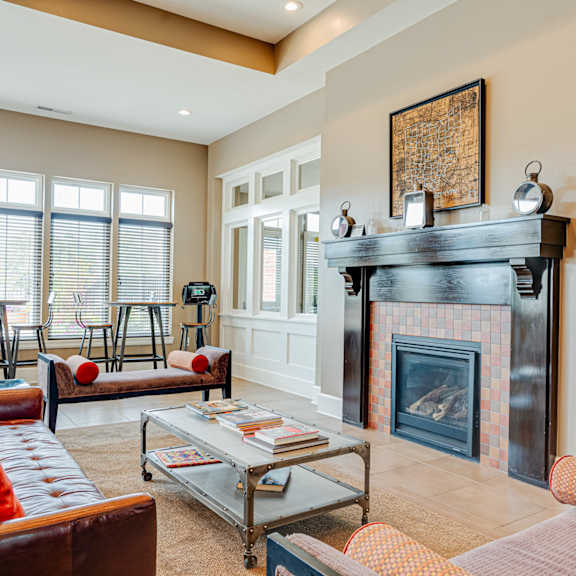 a living room with a fireplace and couches