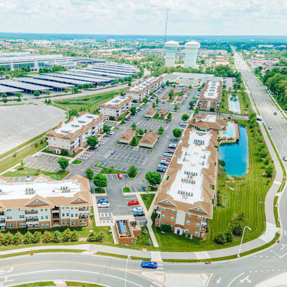 an aerial view of a city with buildings and a parking lot