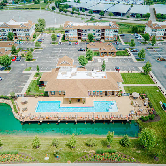 an aerial view of a large swimming pool in a parking lot