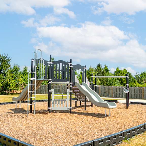 a playground with slides on a sunny day