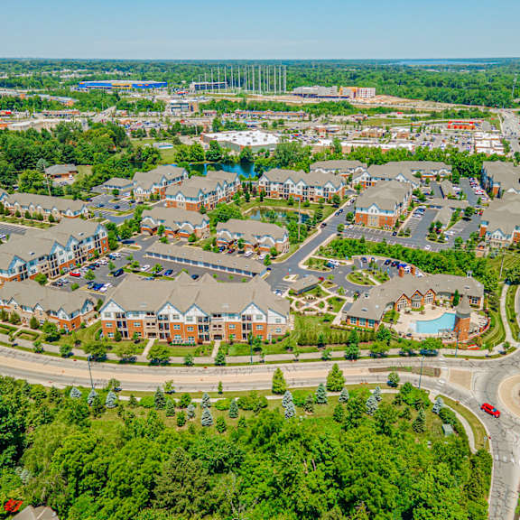 an aerial view of a suburb of a city with houses and roads