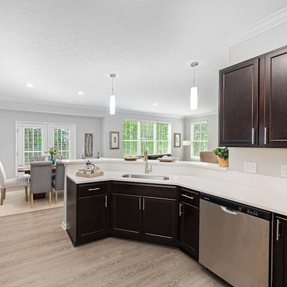 a kitchen and living room with a large counter top