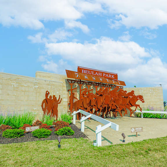 a mural of cattle on the side of a building