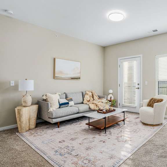 a living room with a couch and a chair