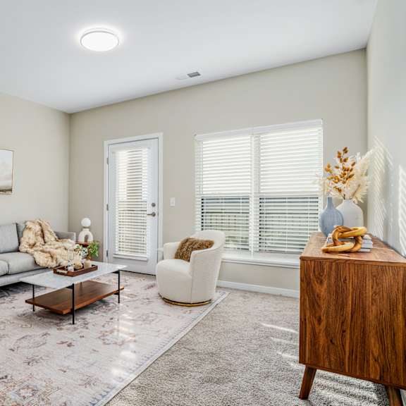 a living room with a couch and a chair