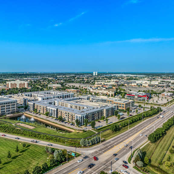an aerial view of a city with buildings and a highway