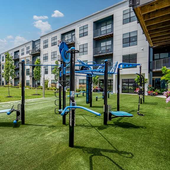 a playground in front of an apartment building