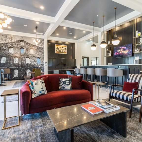 a living room with couches and chairs and a table