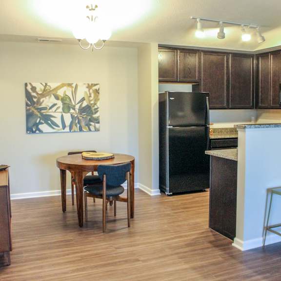 a kitchen and dining area in a 555 waverly unit