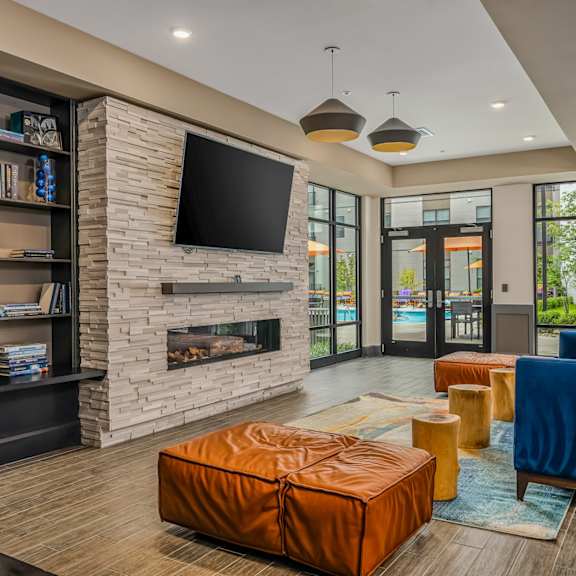 a living room with a fireplace and a television