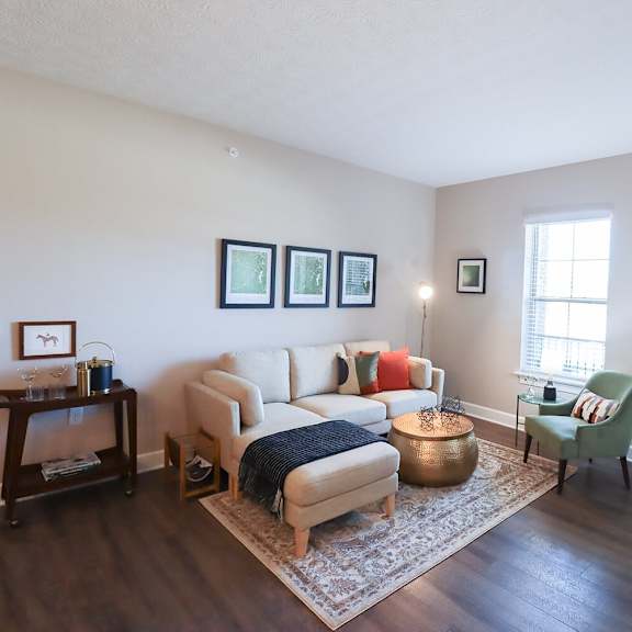 a living room with a couch and a chair