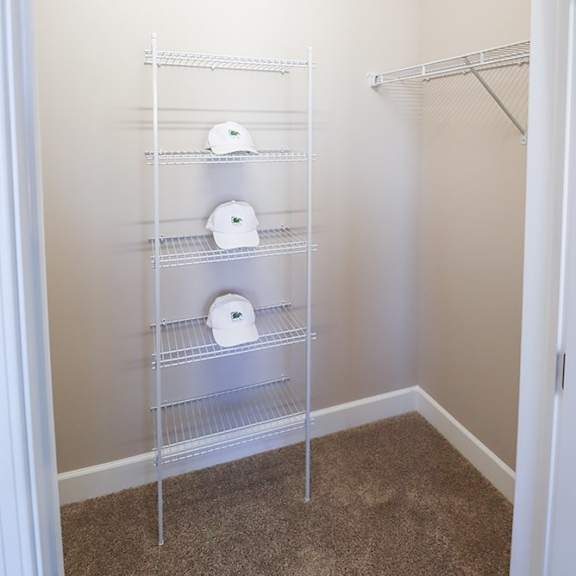 a bathroom with a closet filled with toilet paper