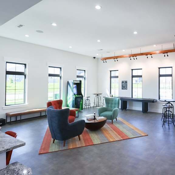 a large room with chairs and a table in the middle