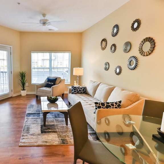 a living room with a couch and a table and a television