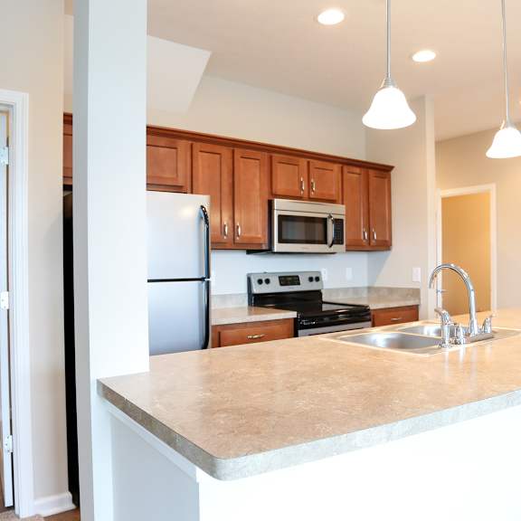 a kitchen with a large counter top and a sink