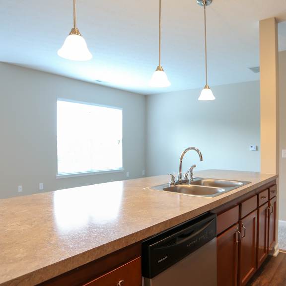 a kitchen with a large counter top and a sink