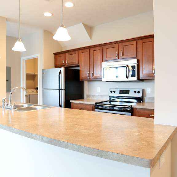 a kitchen with a large counter top and a sink
