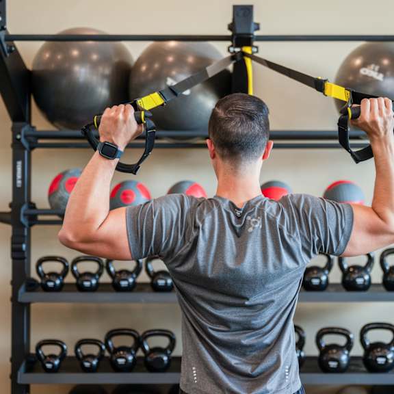 a man working out in a gym with weights