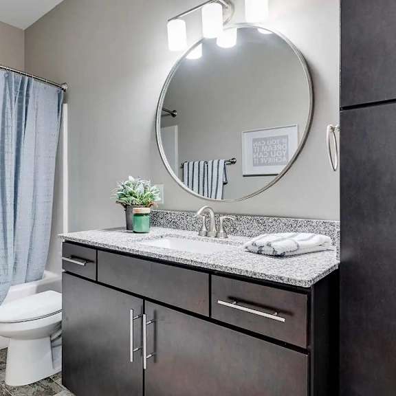Thumbnail 9 of 12 a bathroom with a sink and a toilet. Circle Pines, MN Lexington Lofts