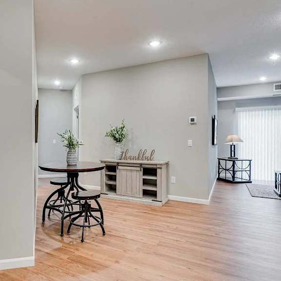 Thumbnail 5 of 12 an open living room with a dining room and a kitchen.  Circle Pines, MN Lexington Lofts