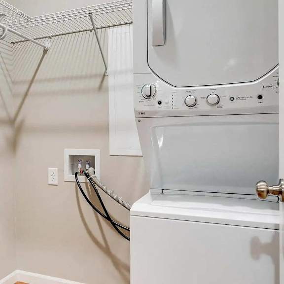 Thumbnail 7 of 7 the laundry room has a washer and dryer and a dryer in it. Circle Pines, MN Lexington Lofts