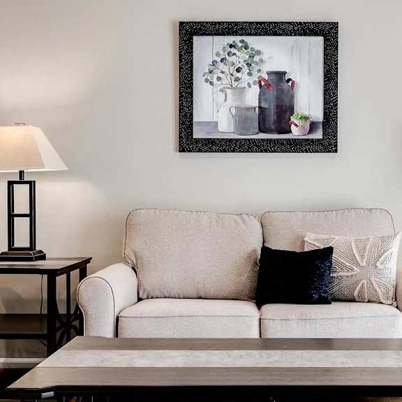 Thumbnail 7 of 9 a living room with a couch and a table with lamps. Circle Pines, MN Lexington Lofts