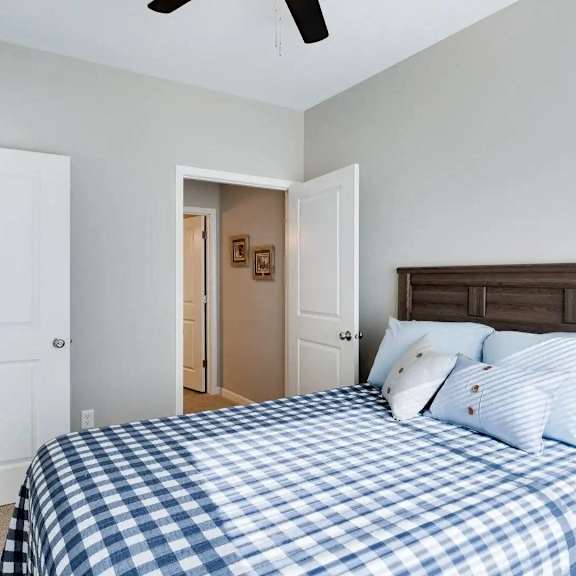 Thumbnail 7 of 8 a bedroom with a bed and a closet. Circle Pines, MN Lexington Lofts
