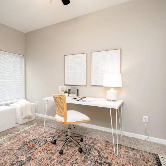 Thumbnail 6 of 6 a home office with a desk and a window. Circle Pines, MN Lexington Lofts