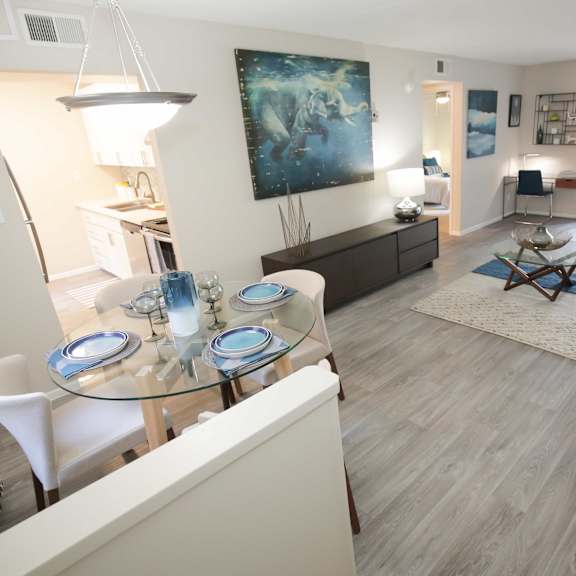 a view of a living room and dining room from the kitchen
