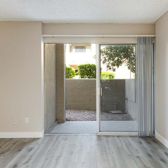 living room with sliding glass doors to an outdoor patio